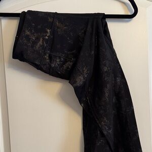 Victoria Sport Total Knockout Black and Gold Patterned Leggings